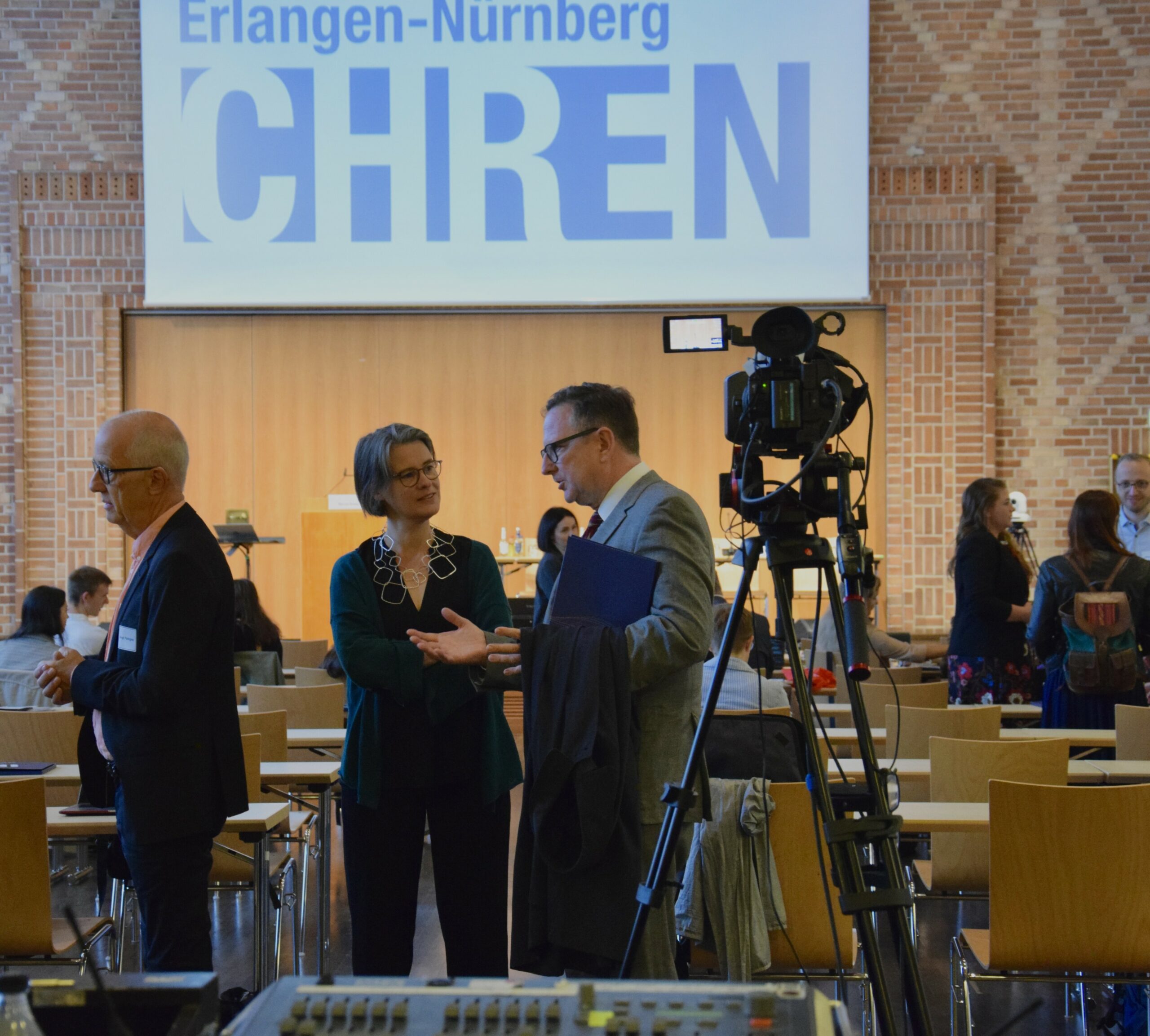 conference speakers talking during break